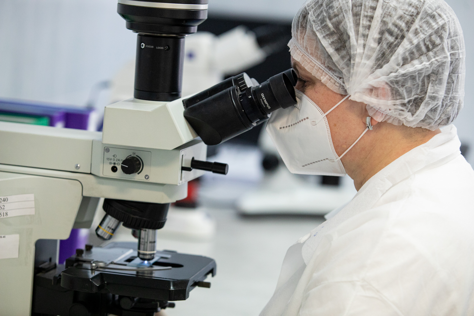 Woman working with microscope