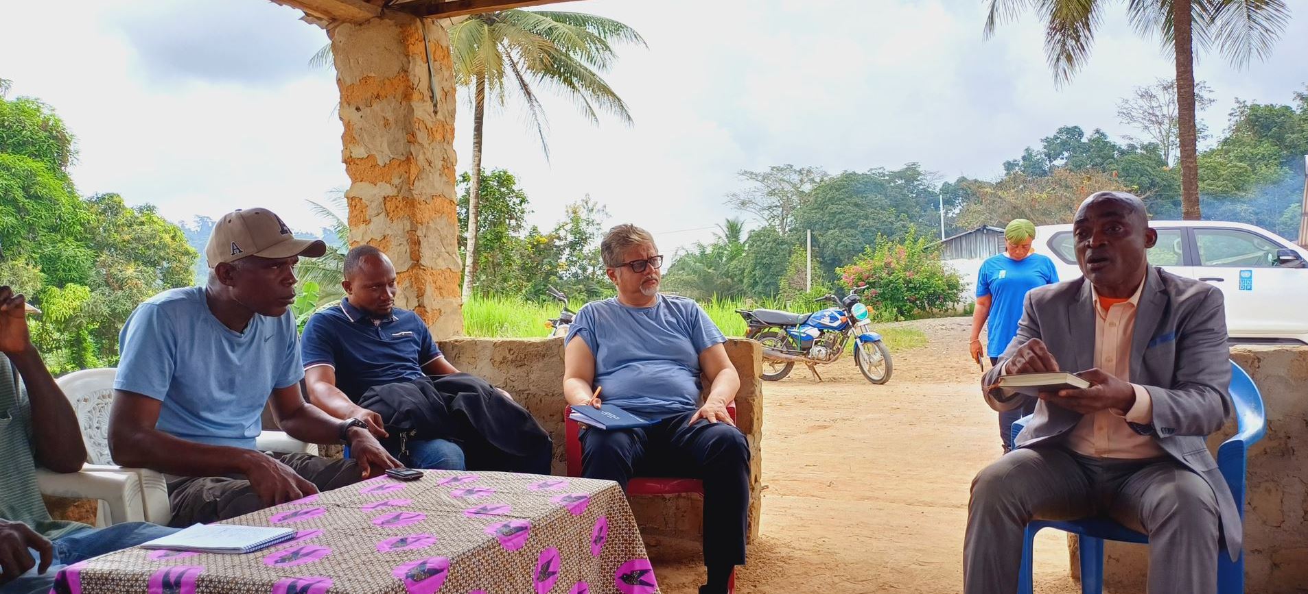 men sitting and talking