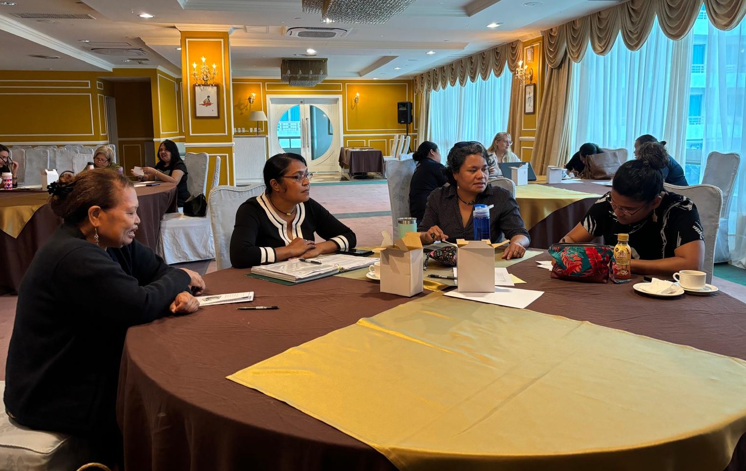 a group of people sitting at a table