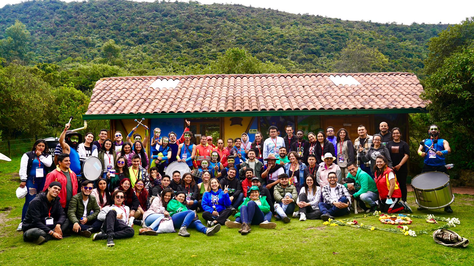 a group of people that are standing in the grass