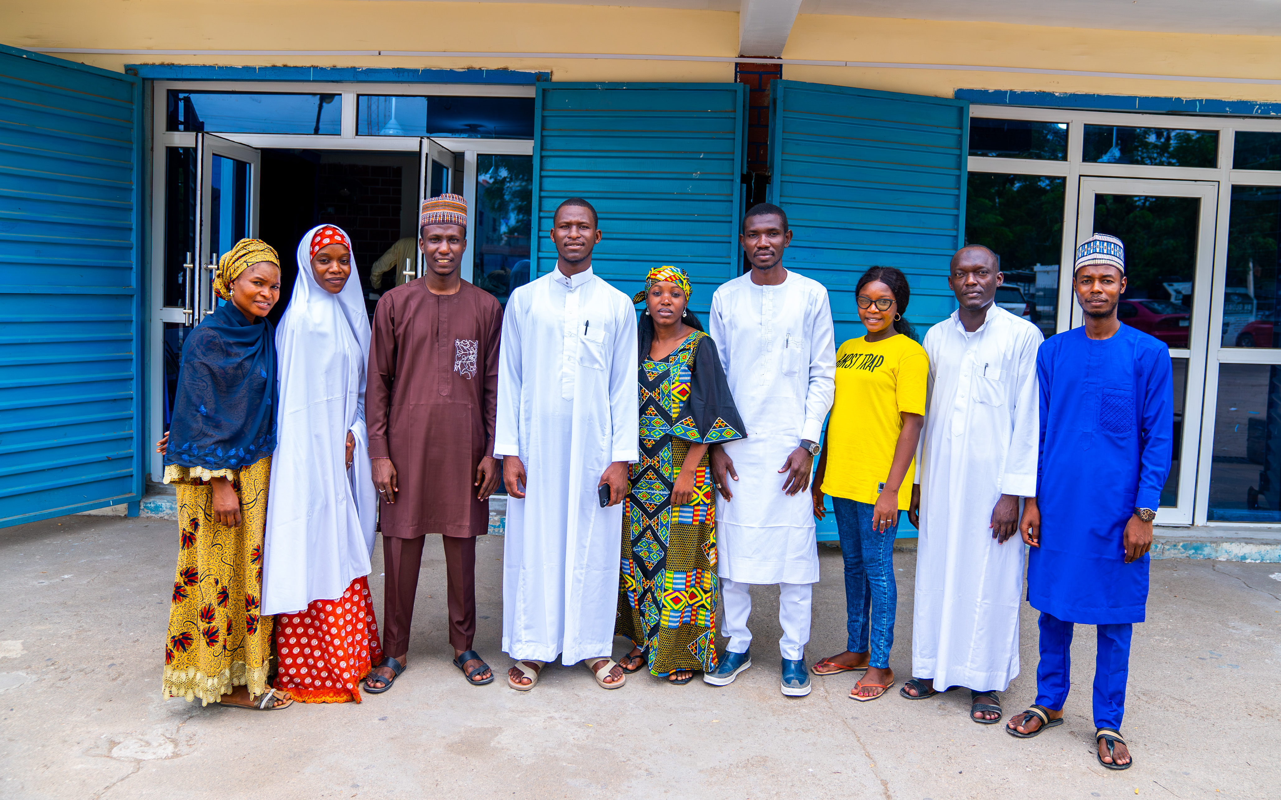 a group of people posing for the camera