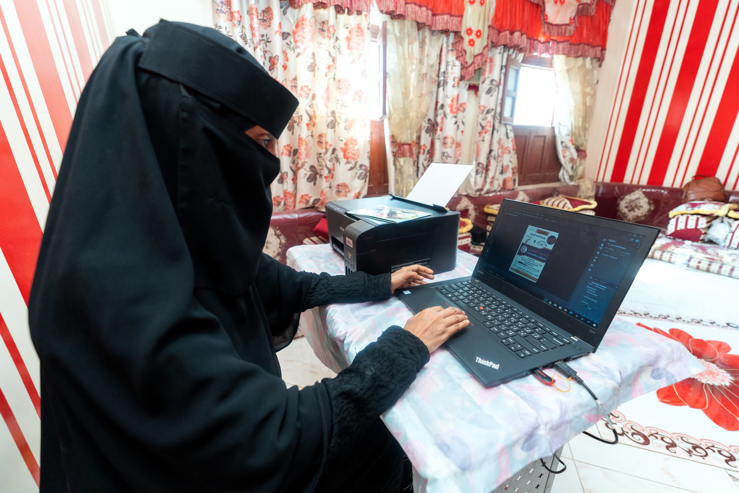 a man holding a laptop