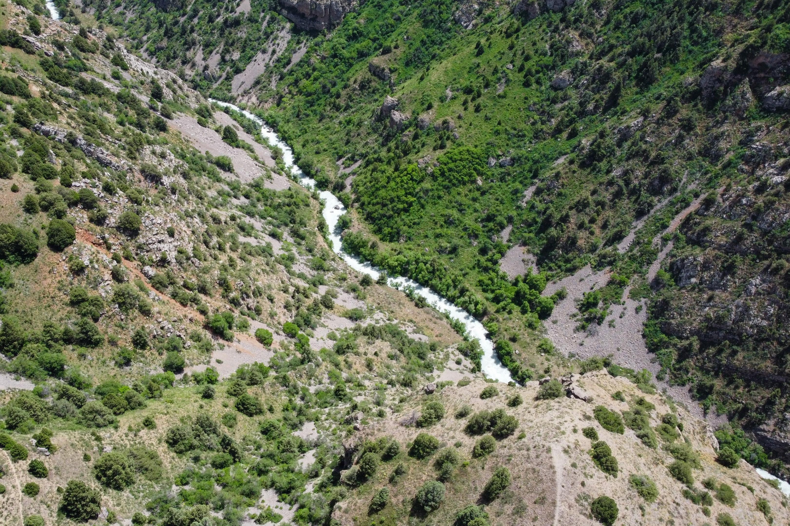 a river in mountains from afar