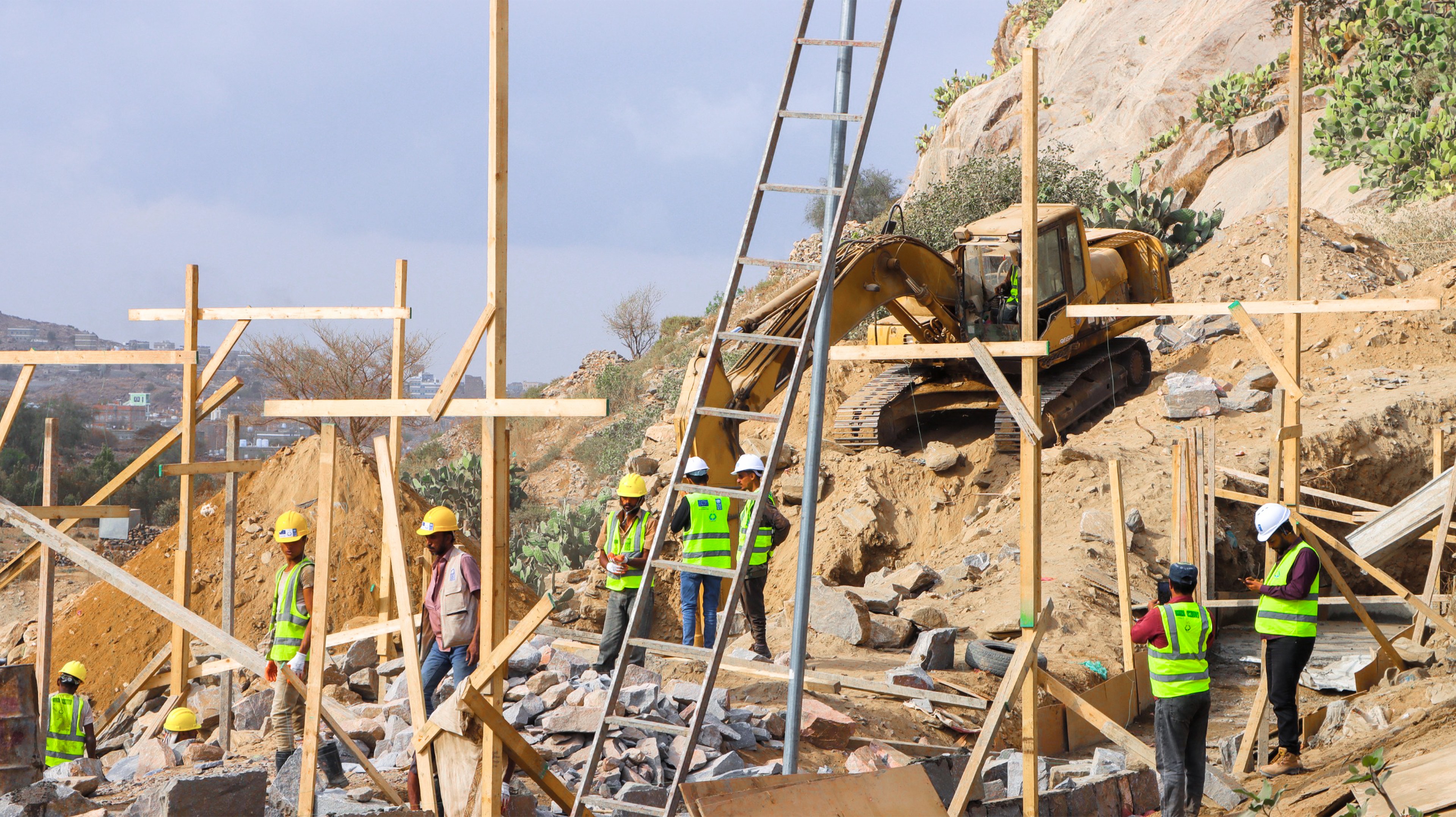 a group of people sitting at a construction site