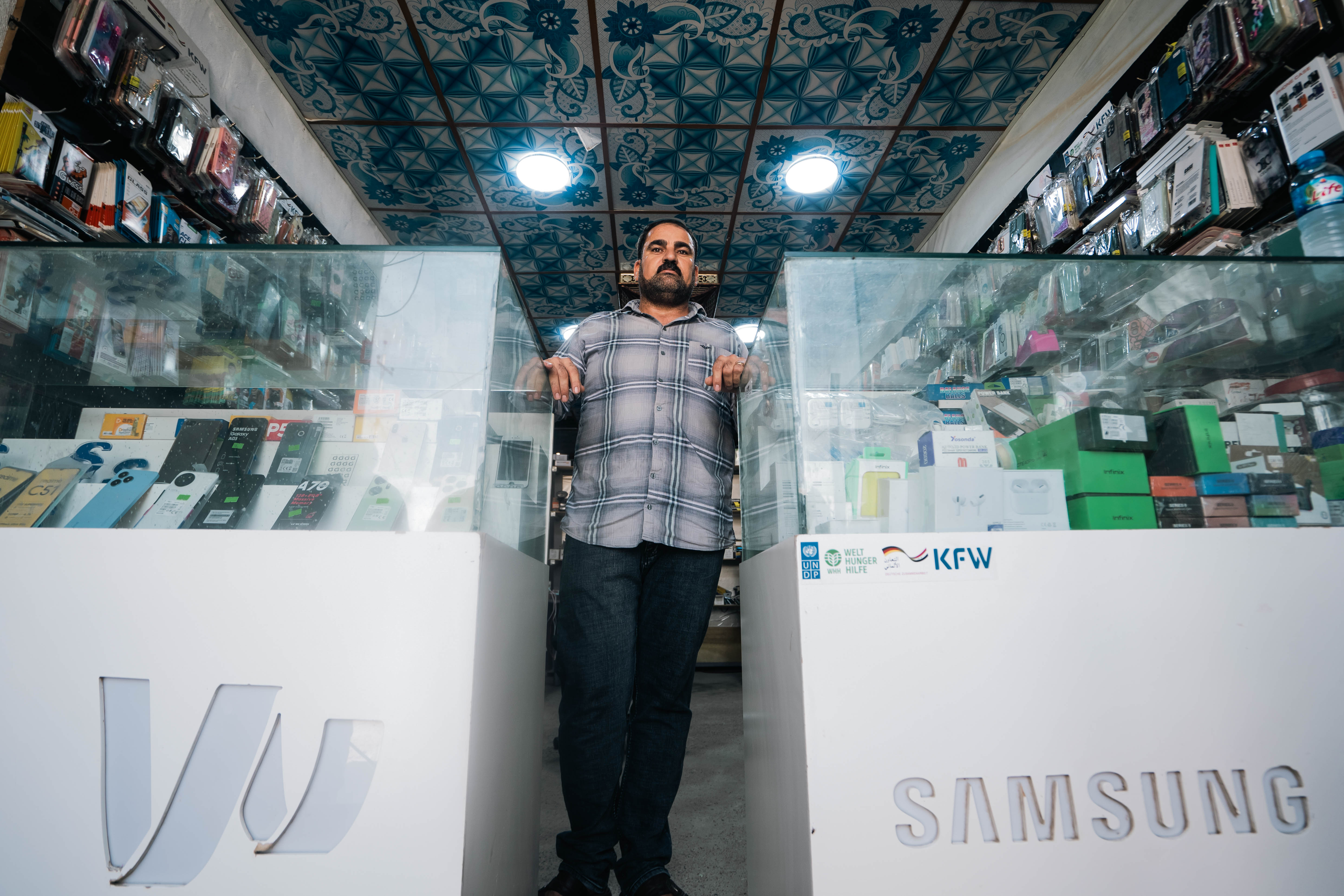 a person standing in front of a store