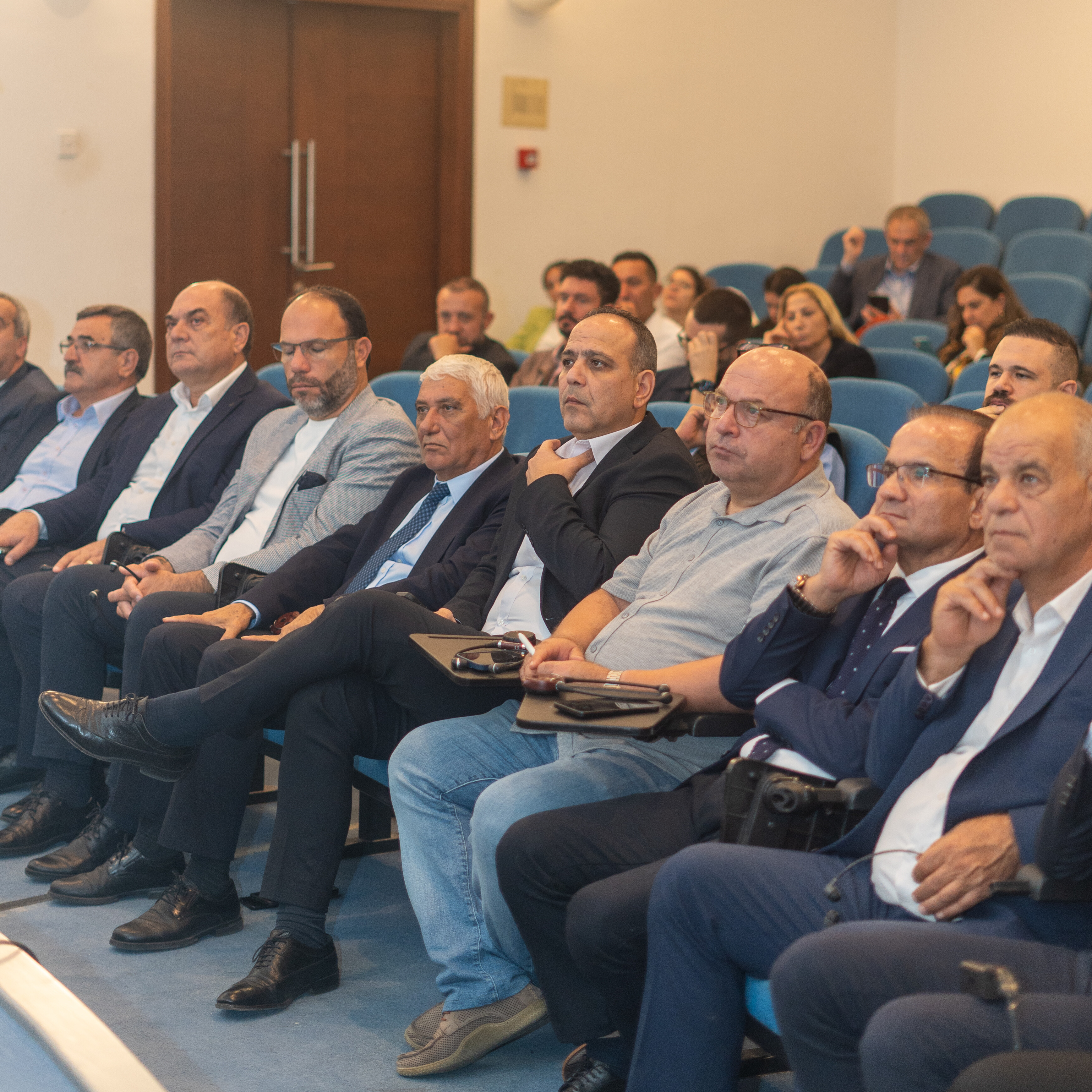 a group of people sitting in a room