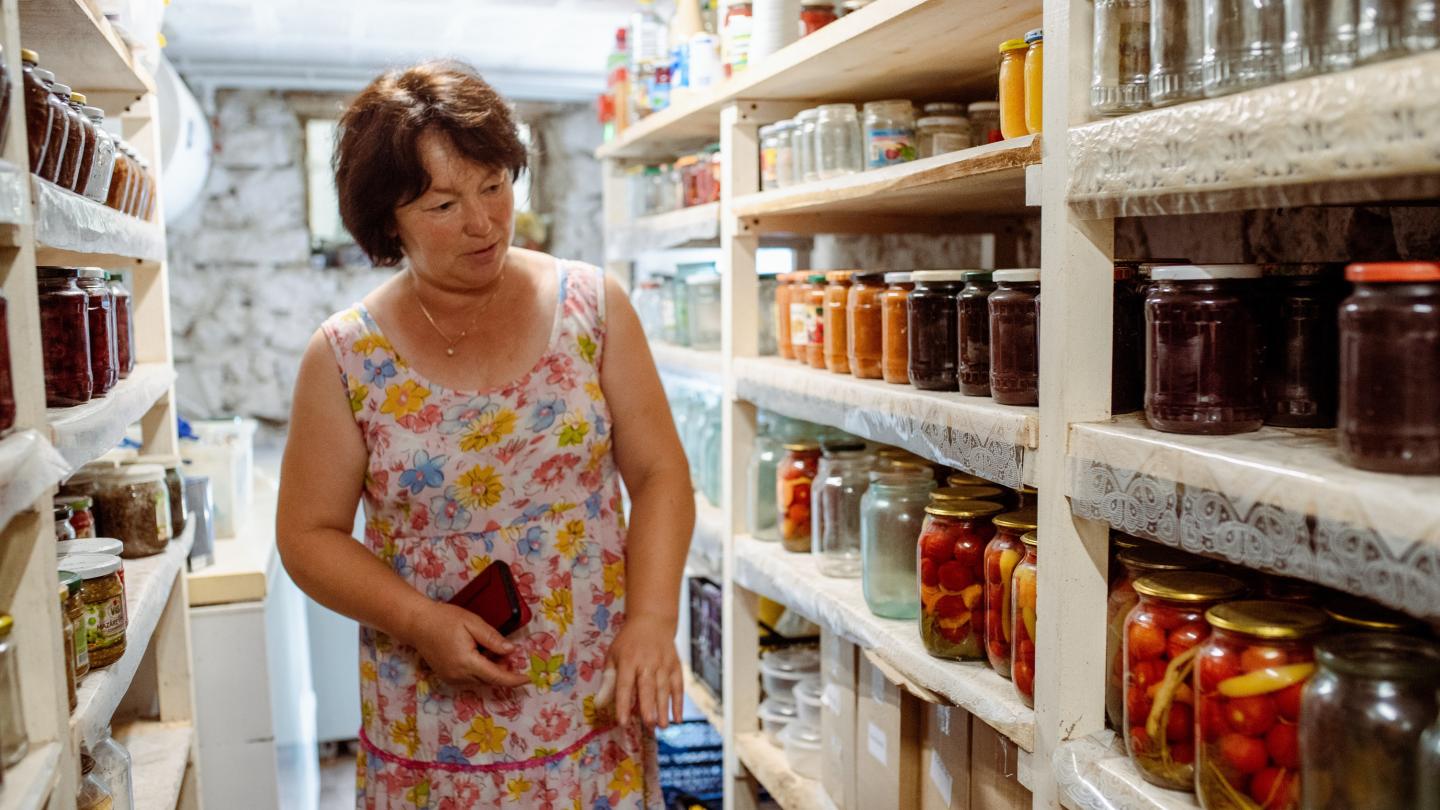 a person standing in front of a refrigerator