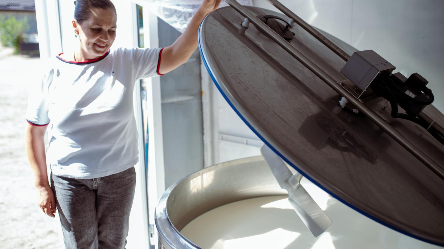 a young man standing on a boat