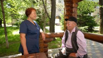 a man and a woman sitting on a bench