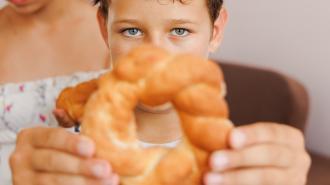 a man and a woman eating a donut